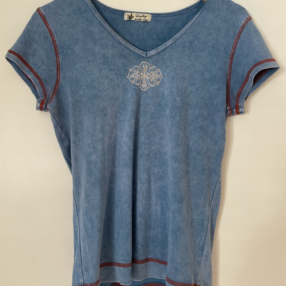 Unity World Wear Blue V-Neck Short Sleeve Top with Embroidered Medallion